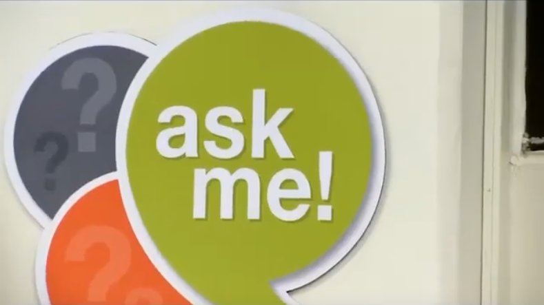 green speech bubble on the wall says ask me!